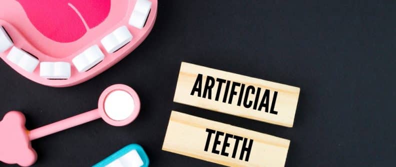 ToothExtractionEquipmentAndTeethWithTheWordArtificialTeeth